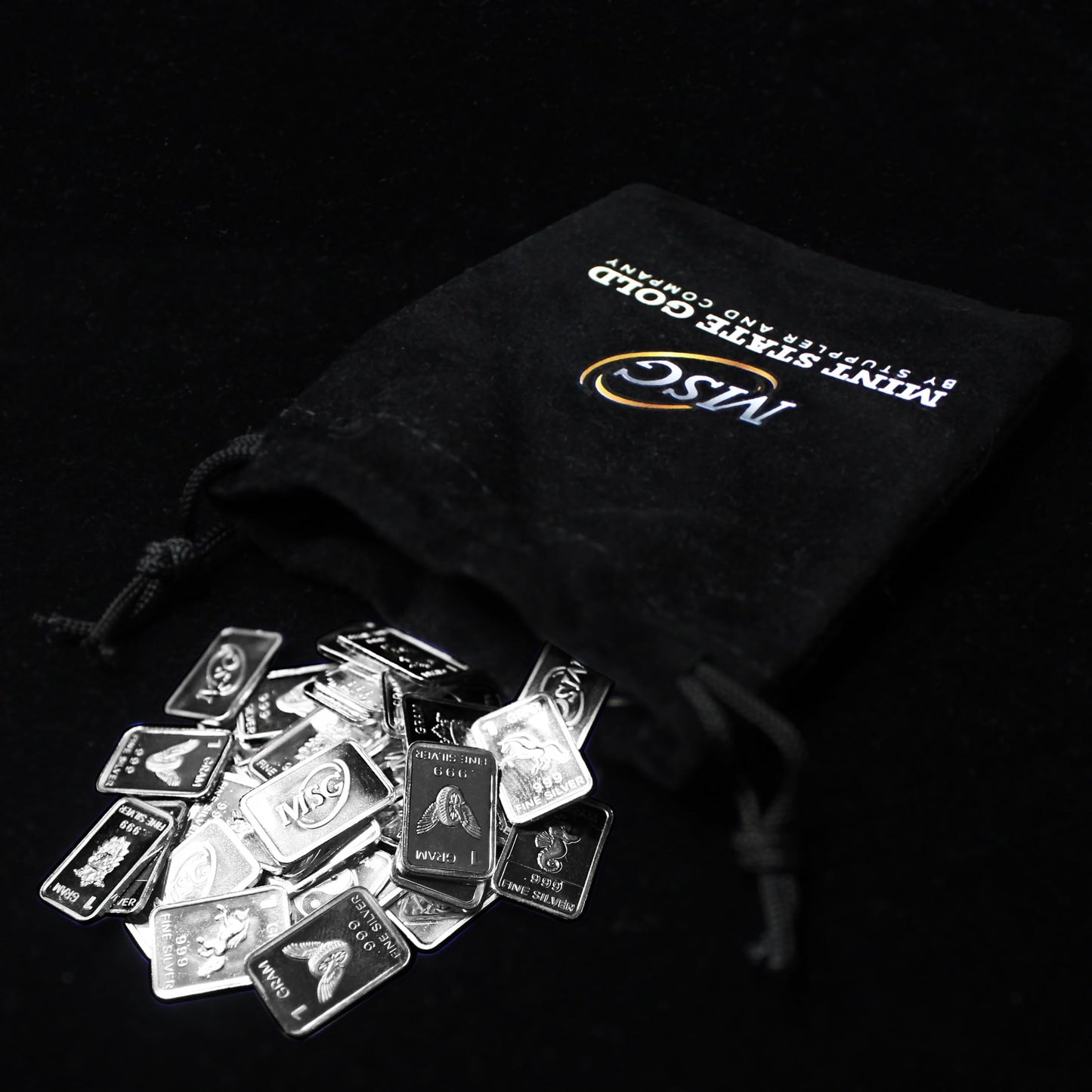 Ten (10) One Gram .999 Pure Silver Bars with Random Designs in a Jewelry Pouch by Mint State Gold