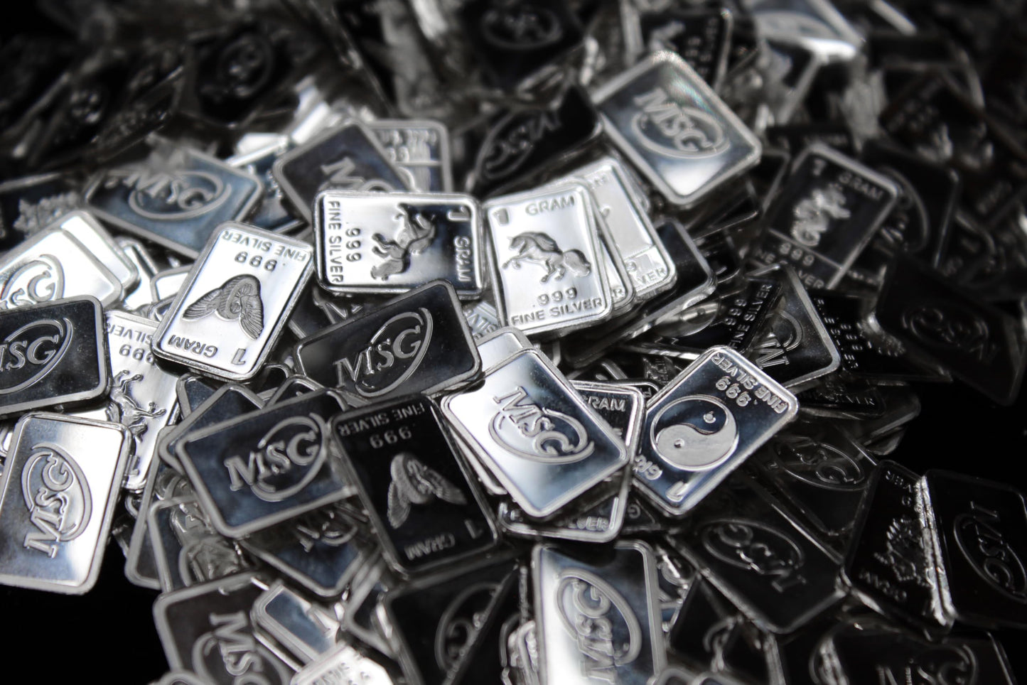 Ten (10) One Gram .999 Pure Silver Bars with Random Designs in a Jewelry Pouch by Mint State Gold