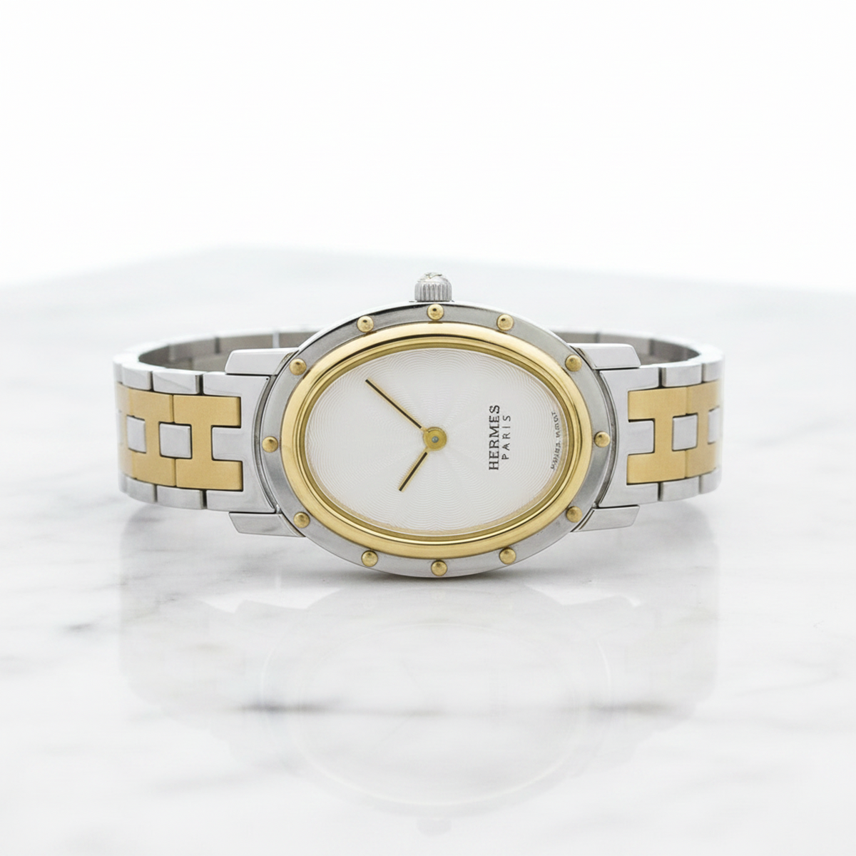 Hermès Clipper Oval · Steel & Gold