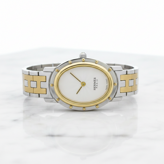 Hermès Clipper Oval · Steel & Gold